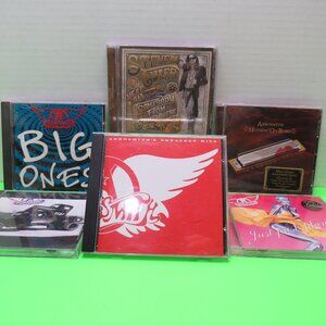 Lot of 6 Aerosmith CD's.  Please inspect pictures and zoom in.